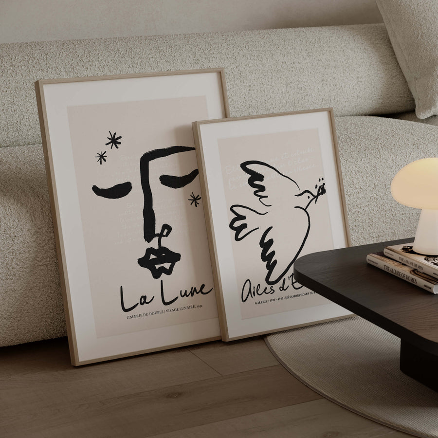 Abstract line art face with closed eyes in black ink. Poetic and feminine moon-themed wall art print with French quote overlay.