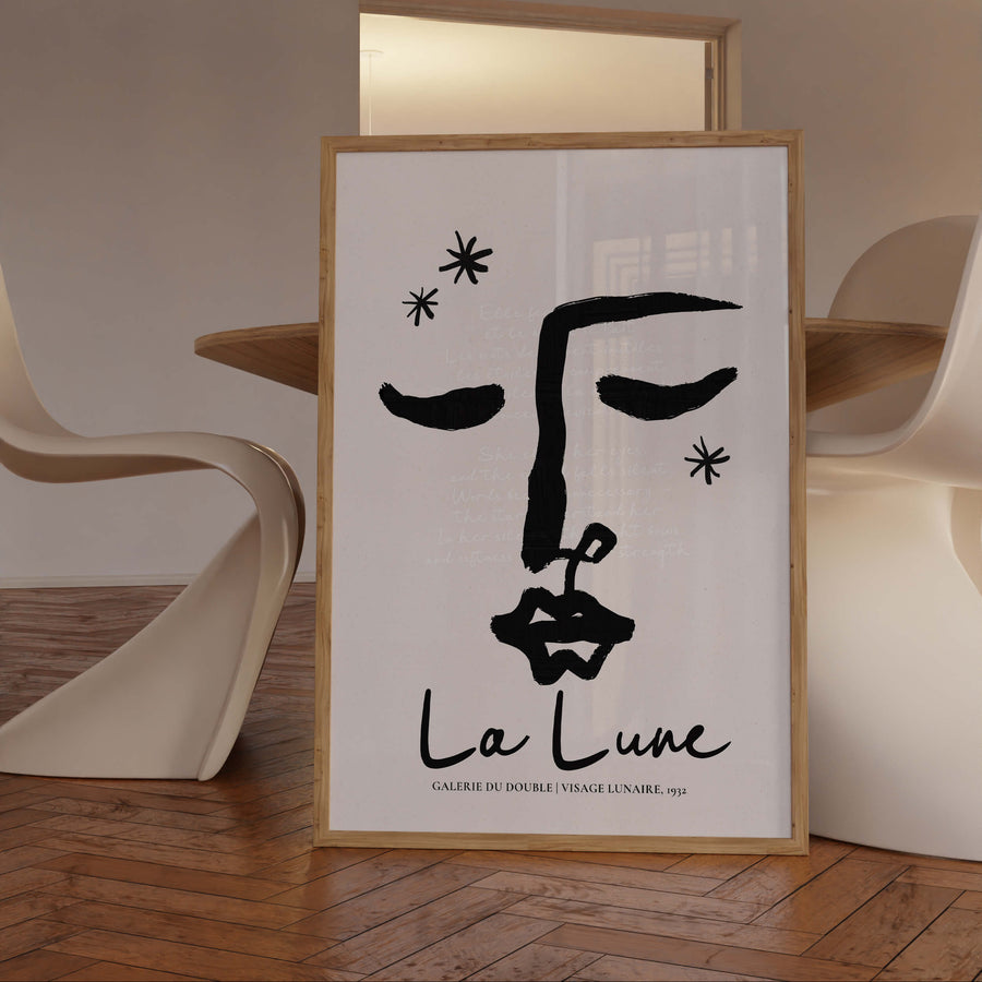 Abstract line art face with closed eyes in black ink. Poetic and feminine moon-themed wall art print with French quote overlay.