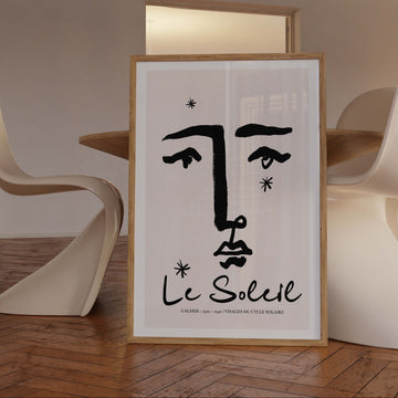 Minimalist black line art of a feminine face with open eyes. Inspired by the sun, awareness, and radiant energy with poetic French text.