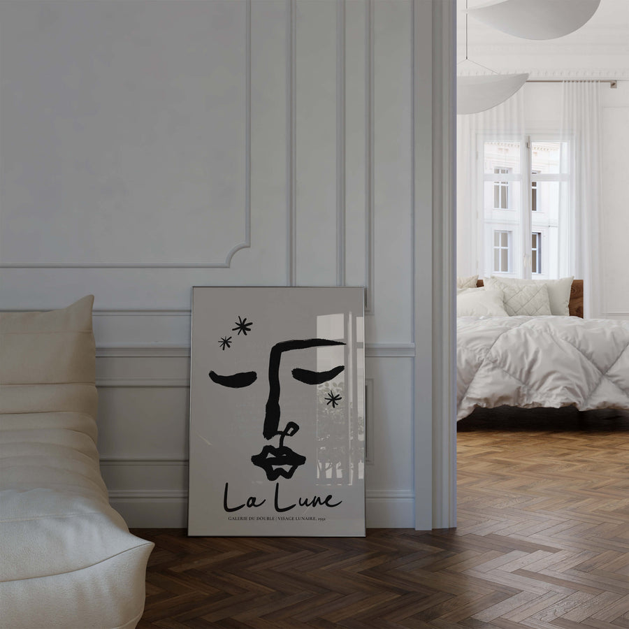 Abstract line art face with closed eyes in black ink. Poetic and feminine moon-themed wall art print with French quote overlay.