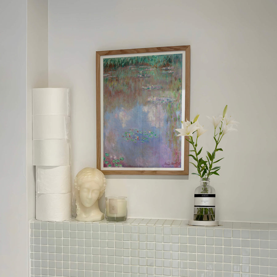 Claude Monet's water lily pond with soft reflections in pink, green and violet hues – pastel Impressionist print.