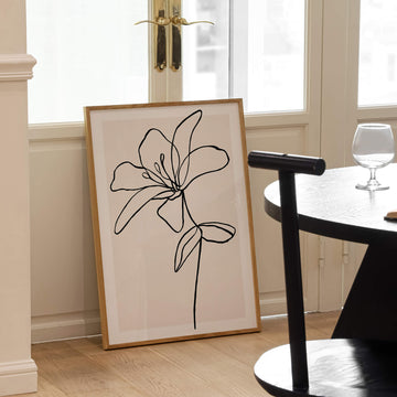 Minimalist black line art of a blooming flower with abstract flowing petals and soft neutral background – botanical modern wall art from EDGE Wall Art Australia.