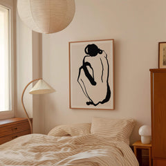 Minimal black line art print of a seated female figure on a neutral background. Inspired by Picasso-style silhouette drawings.