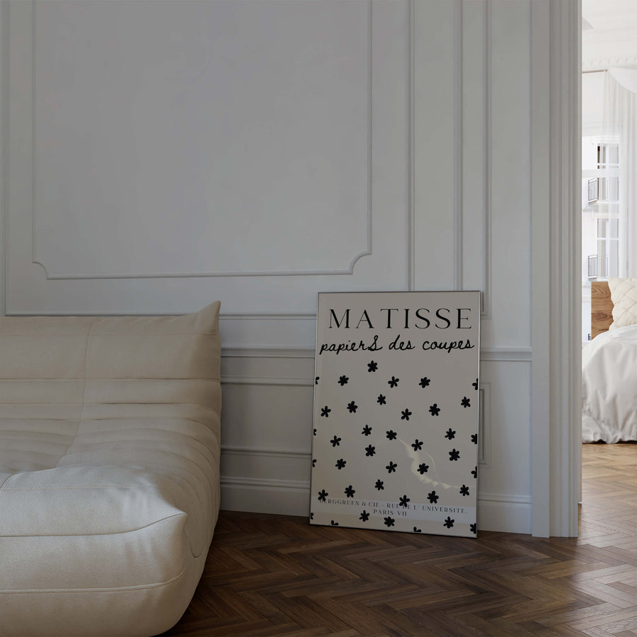 Matisse-inspired Stars Print featuring black floral cut-out shapes scattered on a neutral beige background. A minimalist and elegant botanical wall art piece. Get 2PrintsFor$100 that comes with Free Shipping 🚚💫 in Australia.
