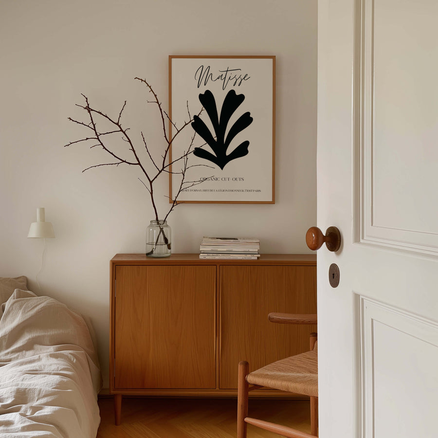 Matisse-inspired black organic cut-out print featuring bold abstract botanical shapes on a neutral background. A minimalist and modern wall art piece. Get 2PrintsFor$100 that comes with Free Shipping 🚚💫 in Australia.