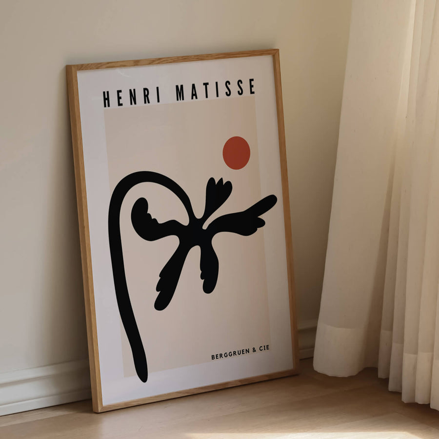 Matisse-inspired black abstract palm print featuring organic cut-out shapes with a terracotta sun on a neutral beige background. A modern and minimalist botanical wall art piece. Get 2PrintsFor$100 that comes with Free Shipping 🚚💫 in Australia.