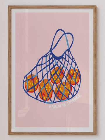 Illustrated Valencia oranges in a blue net bag on pink background – fruity retro kitchen wall art print. Get 2PrintsFor$100 + Free Shipping in Australia.